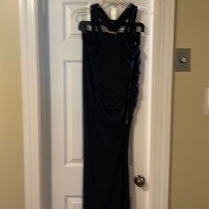 Top and skirt (set) navy color with gold zipper and a buckle , skirt with slit